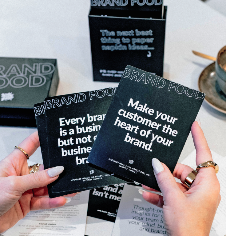 Brand Food Deck cards held in hand